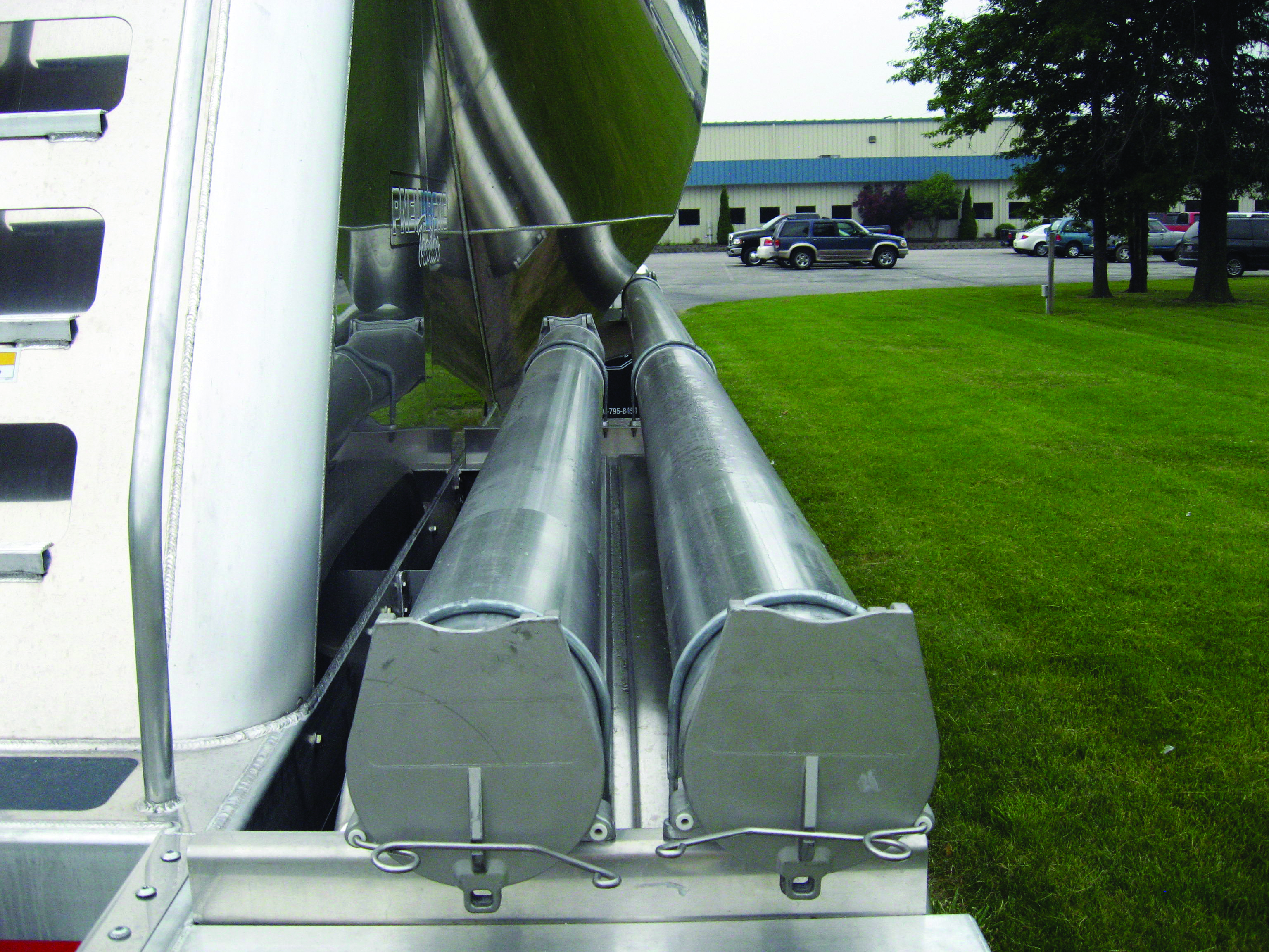 Hose storage tube for vacuum pneumatic tank