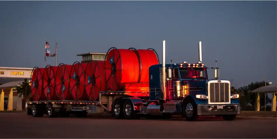 Peterbilt semi truck with MAC Trailer Drop Deck attached.