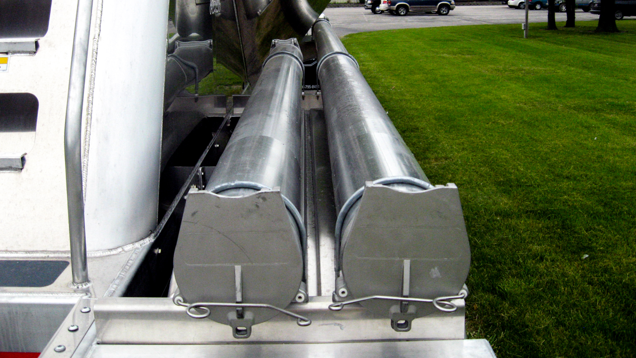 Hose storage tube for lead and pup pneumatic tank